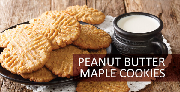 Plate of peanut butter maple cookies with a cup of milk.