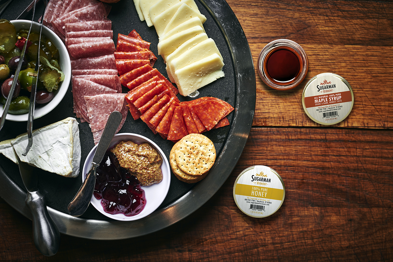 A,Plate,Of,Sliced,Cheeses,And,Meats